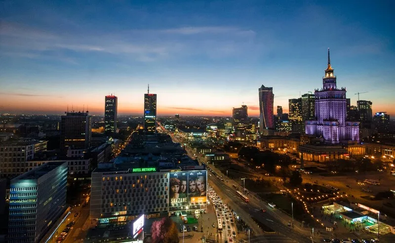 Bustling Warsaw skyline at dusk, offering an immersive Polish language and cultural experience