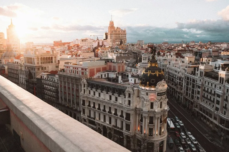 Sunset over Madrid's vibrant skyline enhances the immersive Spanish language experience